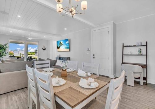a dining room and living room with a table and chairs at Bayview Pointe in Cortez