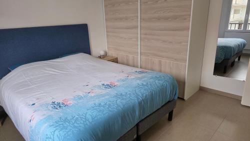 Posteľ alebo postele v izbe v ubytovaní appartement de standing
