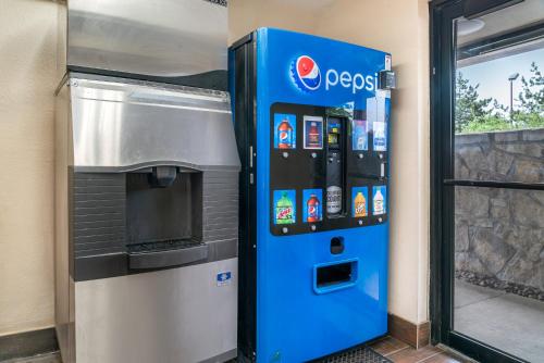 a pepsi machine in front of a building at Red Roof Inn Detroit Metro Airport - Taylor in Taylor