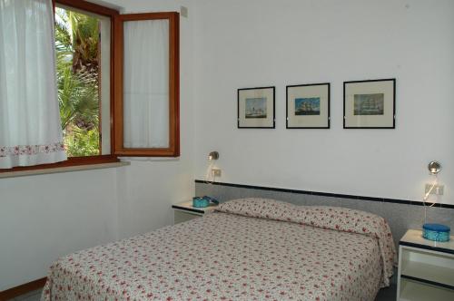 Vuode tai vuoteita majoituspaikassa Residence Cala dei Peducelli