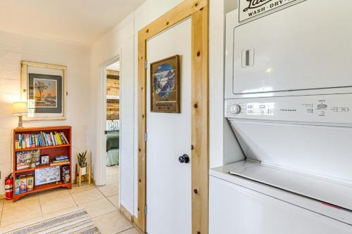 a living room with a fireplace and a tv at 5 Mi to Joshua Tree National Park Desert Oasis! in Twentynine Palms