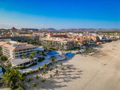 an aerial view of a resort with palm trees and a beach at GR Solaris Lighthouse - All Inclusive in San José del Cabo
