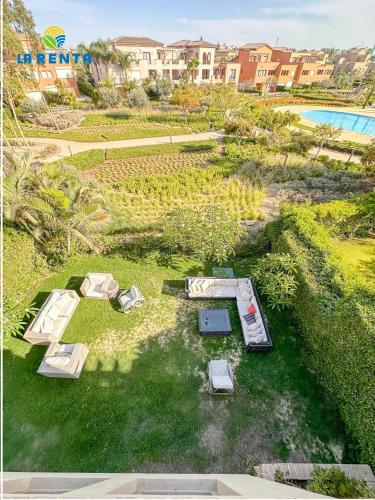 an overhead view of a yard with beds and a pool at Marassi Veneto villa in El Alamein