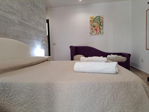 Ένα ή περισσότερα κρεβάτια σε δωμάτιο στο Casale Salento