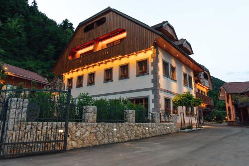a building with lights on the side of it at Menart Estate in Cerklje na Gorenjskem