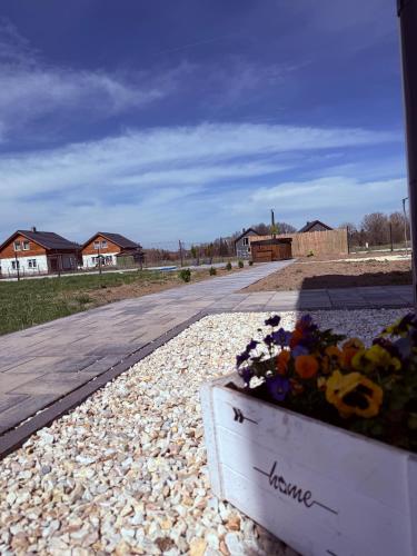 a box of flowers sitting on the side of a road at Makówka in Mysłakowice