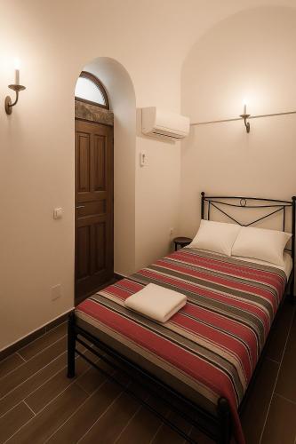 Ένα ή περισσότερα κρεβάτια σε δωμάτιο στο Atrium Manor House 嵐