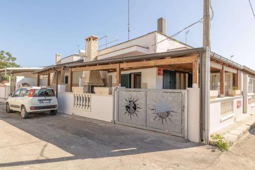 a house with a gate in front of it at B&B Pilella in Alliste