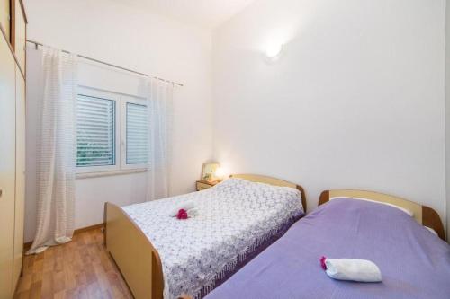 En eller flere senge i et værelse på Apartment Apartman Toni