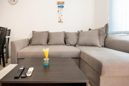a living room with a couch and a coffee table at Marea 1 in Pomorie