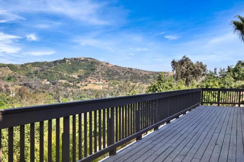 a wooden deck with a view of a mountain at Luxury 5 bedroom Wine Retreat Fallbrook Villa sleeps 12 in Fallbrook