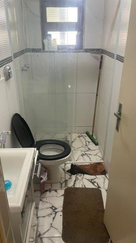 a bathroom with a toilet and a sink at Chalé La Belle de Jour - Camping Carrion - 10 min Cacau Park - Itu -SP in Itu