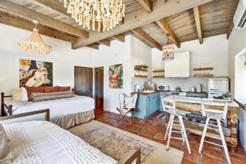 a kitchen and living room with a bed and a dining room at Luxury 5 bedroom Wine Retreat Fallbrook Villa sleeps 12 in Fallbrook