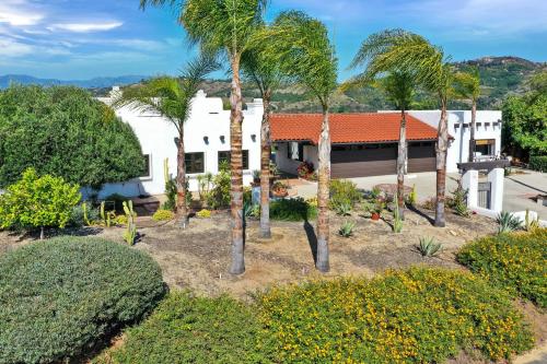 an aerial view of a house with palm trees at Luxury 5 bedroom Wine Retreat Fallbrook Villa sleeps 12 in Fallbrook
