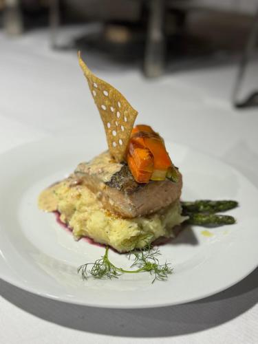 a piece of food on a plate on a table at OASSIS CONEXION SIN FRONTERAS in San Francisco