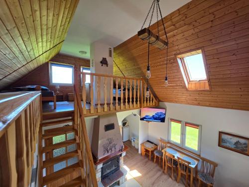 an overhead view of a house with a wooden staircase at Domek pod Czulnią in Uherce Mineralne