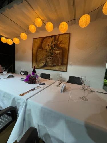 a table with white tablecloths and glasses on it at OASSIS CONEXION SIN FRONTERAS in San Francisco