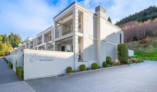 a large white building on the side of a road at Esplanade Villa 16 in Queenstown