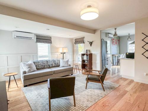 a living room with a couch and a chair at The 4M Favorite House - Stunning & Spotless 2-Bed Apt (#3) in Ann Arbor