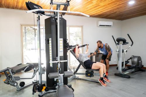 a man and a woman in a gym at Castillo Colonial Nosara - by Pura Villas in Nosara