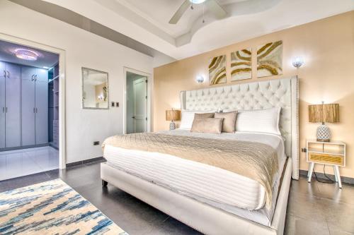 a bedroom with a large bed in a room at Castillo Colonial Nosara - by Pura Villas in Nosara