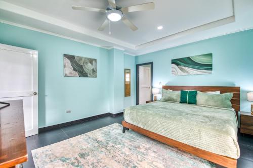 a bedroom with a bed and a ceiling fan at Castillo Colonial Nosara - by Pura Villas in Nosara