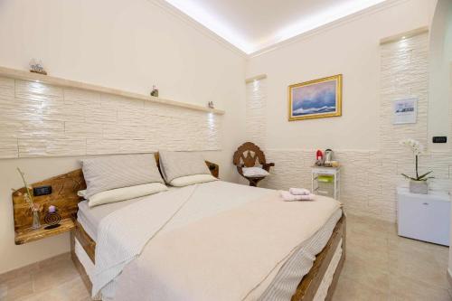 a bedroom with a large bed in a room at B&B Pilella in Alliste