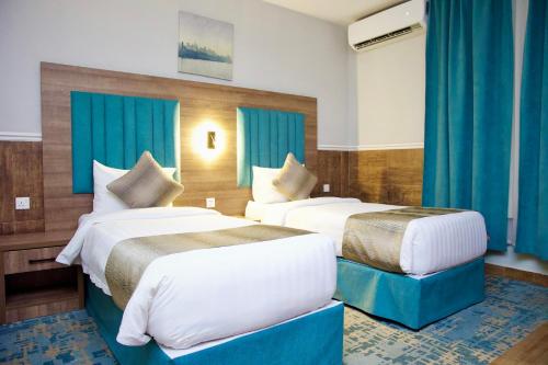 فندق ليوان ان Liwan Inn HOTELにあるベッド