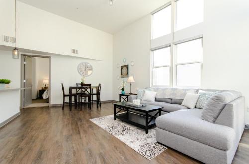 a living room with a couch and a table at Modern 2BR Near Petco Park & Convention Center in San Diego