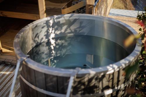 a large metal barrel sitting on the ground at Aparthotel Na Klenici in Mladá Boleslav