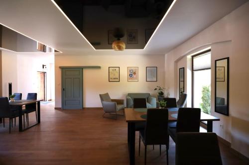 a dining room with a table and chairs at Zajazd Stodoła sauna w cenie in Stronie Śląskie