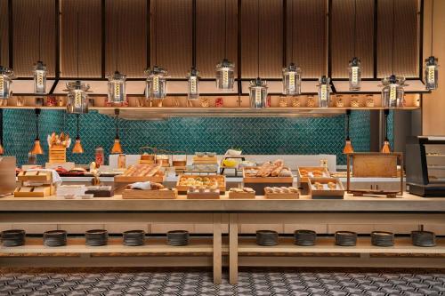a bakery with many different types of food on display at Four Points by Sheraton Suzhou Gusu in Suzhou