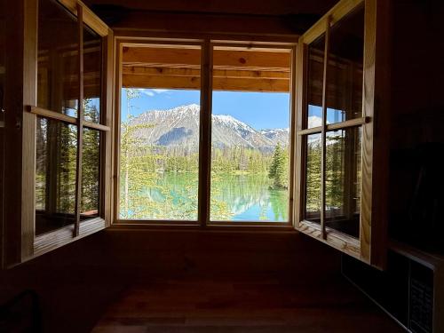 a window with a view of a mountain view at Twin Cabins-Trout and Grayling in Cantwell