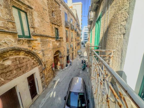 a car parked on a street between two buildings at Casa Iraci La Nostra Sicilia in Trapani