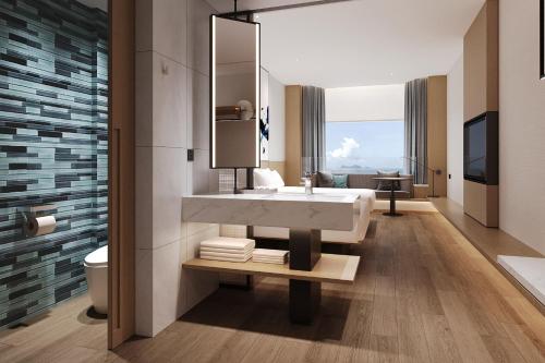 a bathroom with a sink and a toilet at Fairfield by Marriott Yantai in Yantai