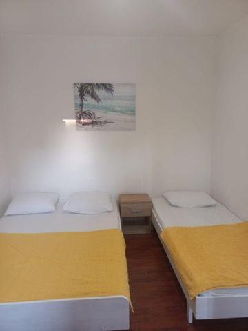 Postel nebo postele na pokoji v ubytování ApartmaniNET