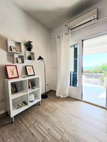 a living room with a large sliding glass door at Paradise found in Komiža