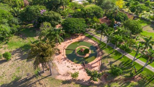 an overhead view of a park with a pond at SR Farm Hotel in Brotas