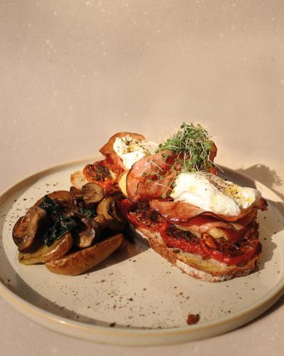 a plate of food with a sandwich and mushrooms at Il Buongustaio in San Salvador
