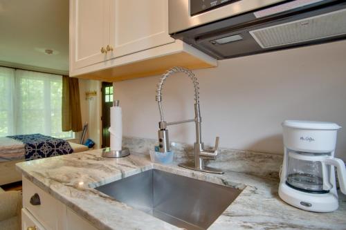 a kitchen counter with a sink and a coffee maker at Walk to Beach and Lighthouse Oak Bluffs Studio! in Oak Bluffs