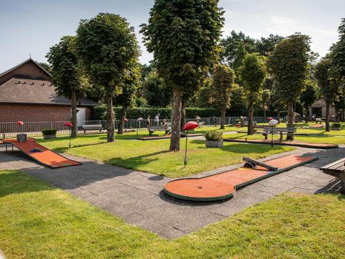 a park with a bunch of skate ramps in the grass at Veldzicht in Bocholt