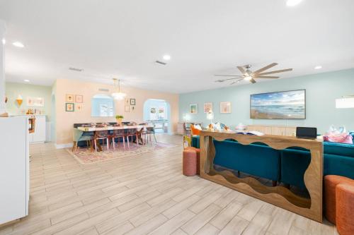 a living room with a kitchen and a dining room at Cozy 3BD ‘Sweet Memories’ | Pool, Games & Hot Tub in Cedar Hammock