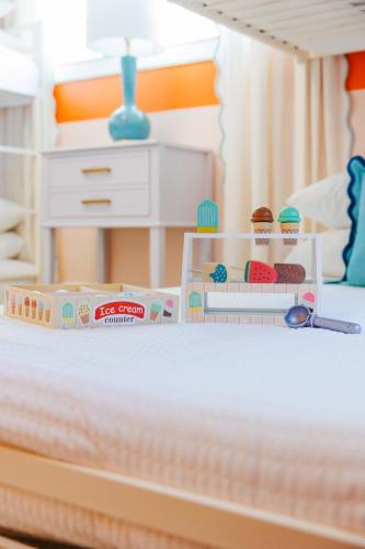 a lego bed with two dolls on it at Cozy 3BD ‘Sweet Memories’ | Pool, Games & Hot Tub in Cedar Hammock