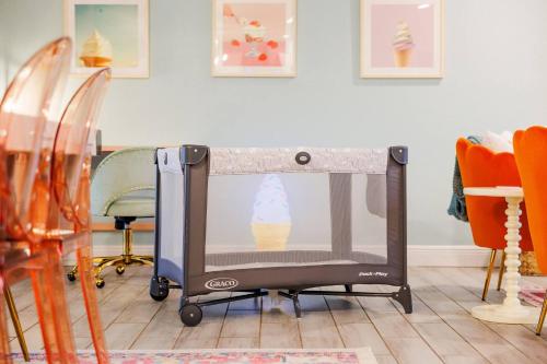 a shopping cart with an ice cream in a room at Cozy 3BD ‘Sweet Memories’ | Pool, Games & Hot Tub in Cedar Hammock