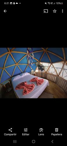 a picture of a room with two meat on a bed at Hostal Ananda in Playa Blanca