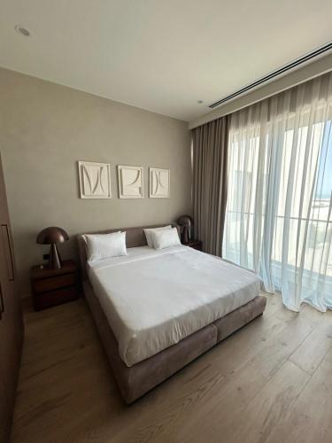 Ένα ή περισσότερα κρεβάτια σε δωμάτιο στο Sea Breeze White Residence apart 210