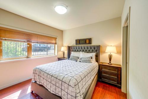 a bedroom with a bed and a window at Steps to Lake Chelan Condo with Resort Amenities! in Chelan
