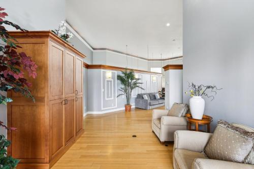 a living room with a large wooden cabinet at New Skagit Tulip Farm Estate 3 beds 2 baths in Mount Vernon