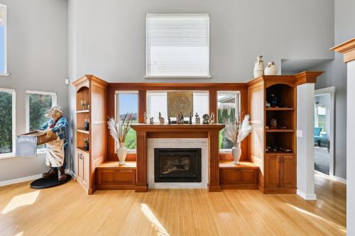 a living room with a fireplace and a window at New Skagit Tulip Farm Estate 3 beds 2 baths in Mount Vernon