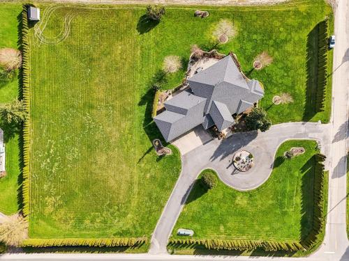an aerial view of a house in a yard at New Skagit Tulip Farm Estate 3 beds 2 baths in Mount Vernon